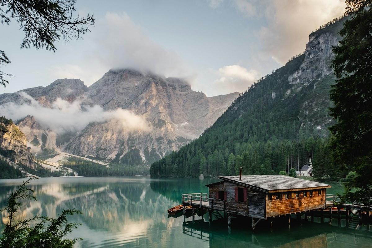 A still lake beneath a mountain range